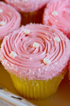 A variety of cupcakes from a dessert buffet at a wedding reception.