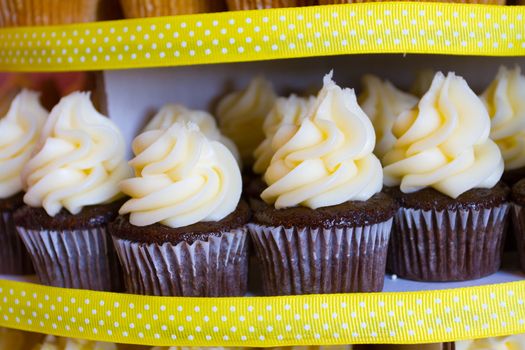 A variety of cupcakes from a dessert buffet at a wedding reception.