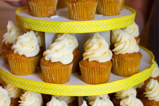 A variety of cupcakes from a dessert buffet at a wedding reception.