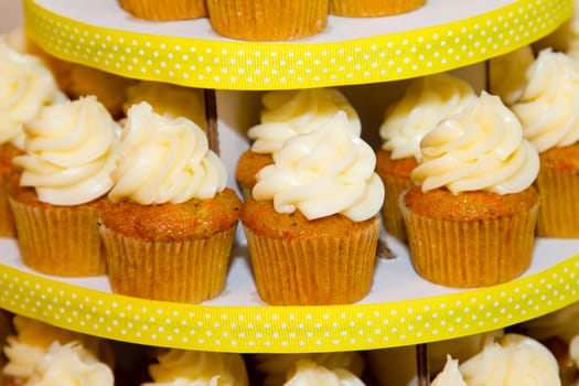 A variety of cupcakes from a dessert buffet at a wedding reception.