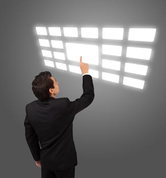 business man pressing touchscreen button 