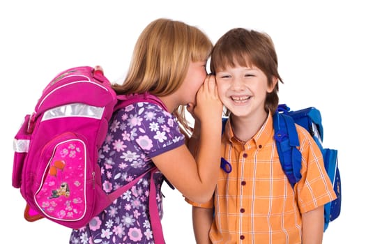 portrait of a blonde girl whispering in boy's ear , isolated on white