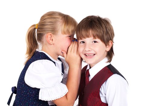 Two little kids telling secrets isolated on white background 