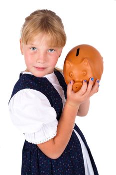 Cute little girl saving money in a piggy-bank, isolated on white