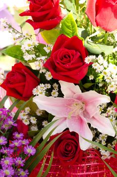colorful spring flowers bouquet. red roses