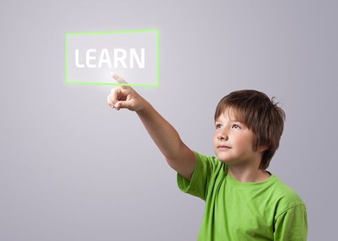 Kid touching LEARN button on a touchscreen 