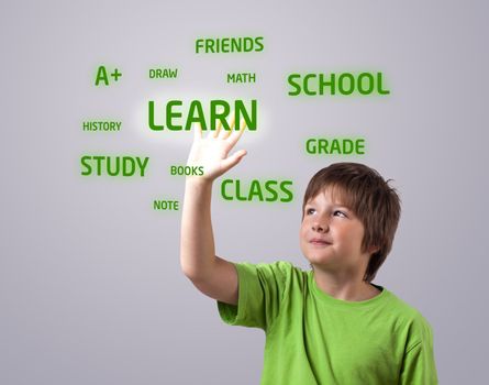 Kid touching LEARN button on a touchscreen 