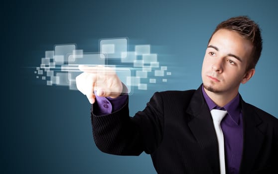 Businessman pressing high tech type of modern buttons on a virtual background