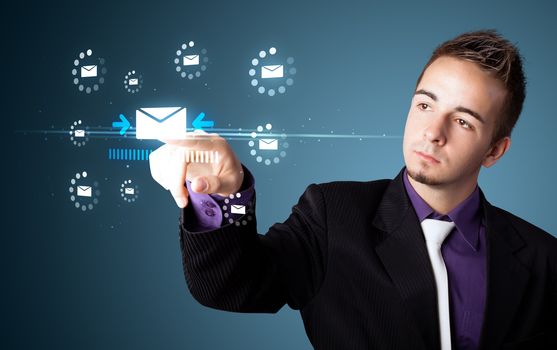 Businessman pressing messaging type of modern icons with virtual background