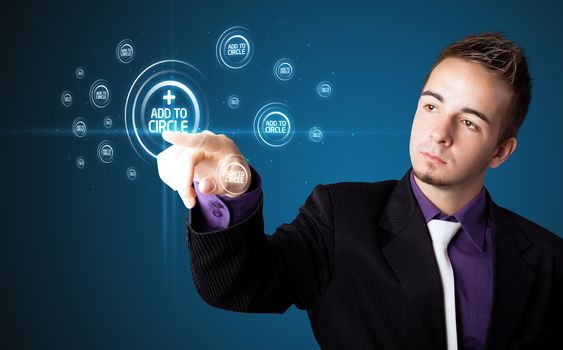 Businessman pressing modern social buttons on a virtual background