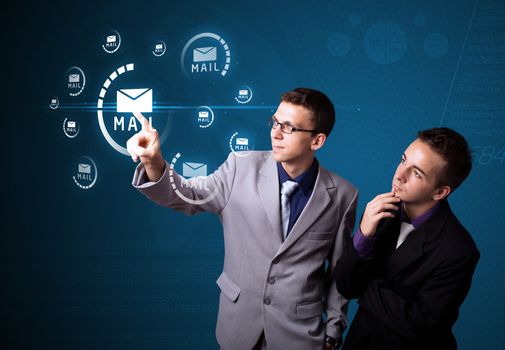 Businessman pressing messaging type of modern icons with virtual background