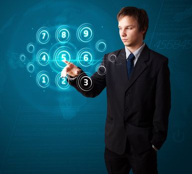 Businessman pressing high tech type of modern buttons on a virtual background