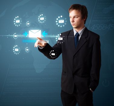 Businessman pressing messaging type of modern icons with virtual background