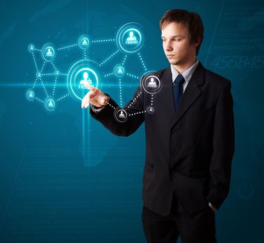 Businessman pressing modern social buttons on a virtual background