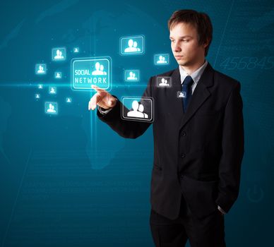 Businessman pressing modern social buttons on a virtual background