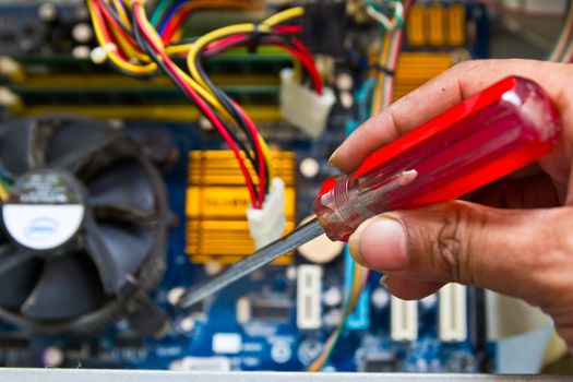 Technician repairing computer hardware in the lab