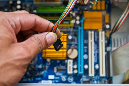 Technician repairing computer hardware in the lab