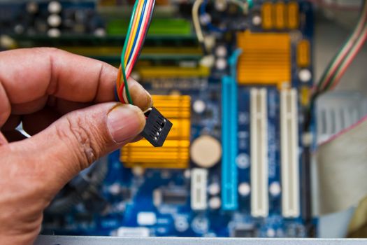 Technician repairing computer hardware in the lab