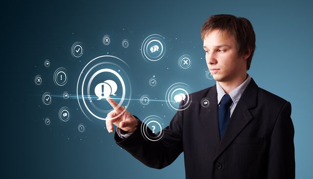 Businessman pressing modern social buttons on a virtual background