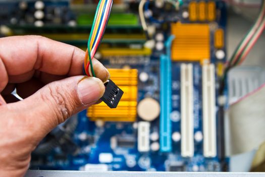 Technician repairing computer hardware in the lab