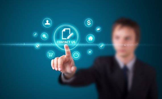 Businessman pressing business type of modern buttons with virtual background
