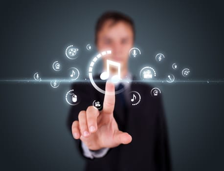 Businessman pressing multimedia type of modern buttons with virtual background