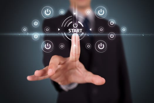 Businessman pressing simple start buttons on a virtual background