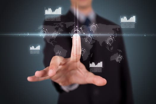 Businessman pressing high tech type of modern buttons on a virtual background