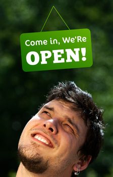 Young persons head looking at closed and open signs