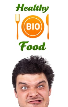 Young persons head looking with gesture at healthy food sign