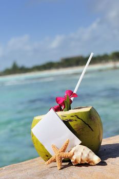 Coconut cocktail starfish tropical Caribbean beach refreshment and towel