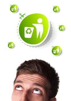 Young persons head looking at green eco sign