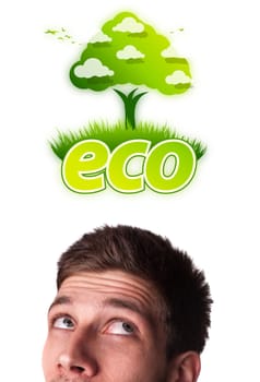 Young persons head looking at green eco sign