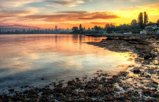 This vivid sunrise over Vancouver with the bay in the foreground is a beautiful landscape.
