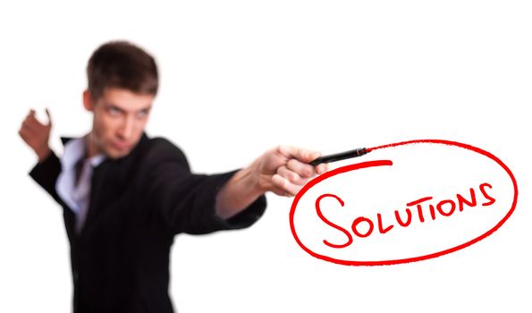 Businessman drawing solutions on whiteboard (selective focus)