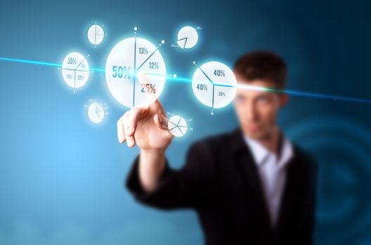 Businessman pressing pie chart button, futuristic technology