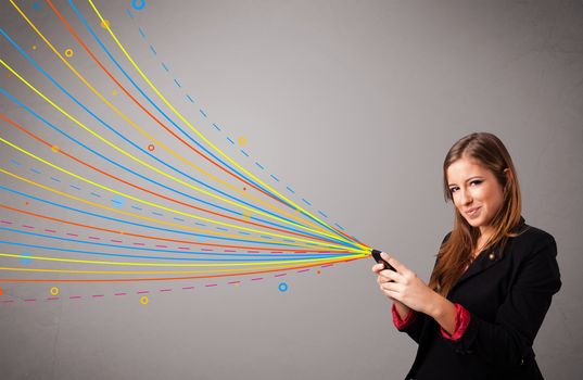 Happy young girl holding a phone with colorful abstract lines