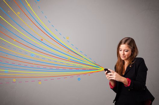 Happy young girl holding a phone with colorful abstract lines