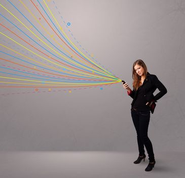 Happy young girl holding a phone with colorful abstract lines