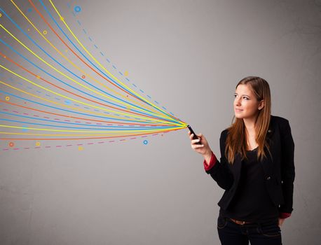 Happy young girl holding a phone with colorful abstract lines