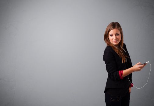 pretty young lady singing and listening to music with copy space