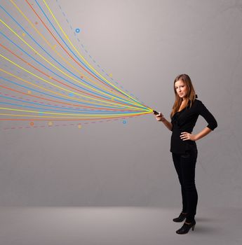 Happy young girl holding a phone with colorful abstract lines