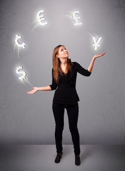 pretty young lady standing and juggling with currency icons