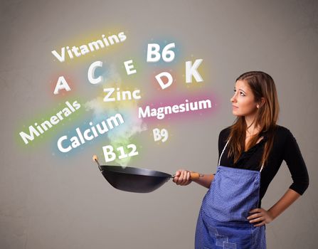 Pretty young woman cooking vitamins and minerals