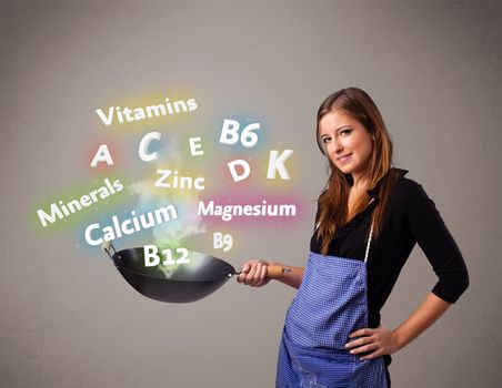 Pretty young woman cooking vitamins and minerals