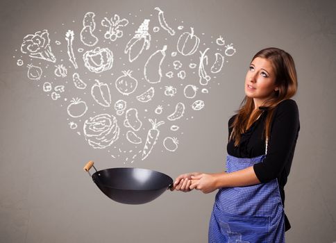 Pretty lady cooking vegetables