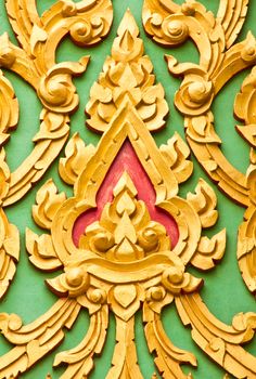 Asian art motifs. The wooden carved into shape.