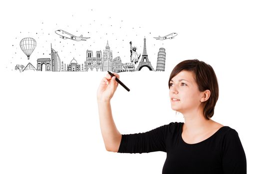 Young woman drawing famous cities and landmarks on whiteboard isolated on white