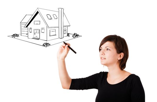 Young woman drawing a house on whiteboard isolated on white