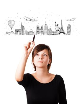 Young woman drawing famous cities and landmarks on whiteboard isolated on white